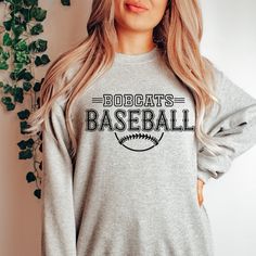 Gear up for success on and off the field with our Custom Baseball Team Sweatshirts, designed to unite your squad in style. Whether you're prepping for game day or celebrating a hard-fought victory, these sweatshirts are the ultimate symbol of team pride. Crafted from premium, ultra-soft fabric, our sweatshirts offer unbeatable comfort and durability, ensuring you stay warm and cozy during those chilly practices and post-game celebrations. But what truly sets them apart is their customizable design – you have the freedom to add your team's logo, name, or any other personalized details that represent your squad's identity. From Little League dreamers to seasoned veterans, our Custom Baseball Team Sweatshirts are perfect for players of all ages and skill levels. Whether you're huddling up in Softball Sweatshirt, Team Sweatshirts, Graphic Apparel, Baseball Team, Crew Sweatshirts, Shirt Ideas, The Field, Team Spirit, Game Day