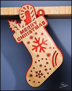 a wooden christmas stocking hanging from a shelf with the words merry christmas written on it