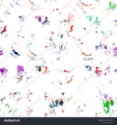 colorful watercolor paint splattered on white paper with lots of different colors and shapes