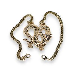 Add an edge of sophistication to your look with the Python Bracelet. This bold snake bracelet features a coiled serpent centerpiece, meticulously crafted with intricate detailing that symbolizes power and transformation. Made with a sleek shiny finish, this bracelet is designed to make a statement. The unique double-clasp design ensures a secure and comfortable fit while adding versatility to the piece. Perfect for both day and night, the serpent bracelet brings an element of fierce elegance to any outfit. Its timeless design and attention to detail make it an essential addition to any jewelry collection. Exposure to the salt from sweat can cause your pieces to become dull. Be mindful that perfume, hairspray and hand lotions may tarnish your gold filled jewelry due to the harsh chemicals t Metal Snake-shaped Jewelry With Adjustable Chain, Snake Shaped Metal Jewelry With Adjustable Chain, Snake-shaped Metal Jewelry With Adjustable Chain, Adjustable Snake-shaped Metal Jewelry, Adjustable Snake Shaped Metal Jewelry, Adjustable Snake Shape Chain Jewelry, Snake Chain Jewelry As Gift, Adjustable Tarnish-resistant Snake-shaped Jewelry, Serpent Bracelet