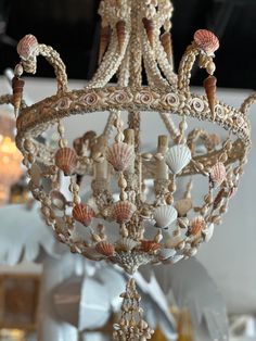 an ornate chandelier with shells and seashells