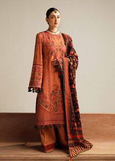 Hussain Rehar Dusky Winter Shawl Khaddar Collection Red Printed Lawn Suit For Wedding, Wedding Lawn Suit In Red With Printed Details, Unstitched Orange Lawn Suit With Digital Print, Orange Printed Cotton Lawn Suit, Festive Orange Printed Lawn Suit, Unstitched Brown Lawn Suit With Printed Motifs, Traditional Orange Lawn Suit With Digital Print, Brown Unstitched Lawn Suit With Printed Motifs, Suites Designs