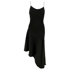 Check out this item from 1stdibs! CELINE Size 6 Black Silk Spaghetti Straps Mid-Calf Cocktail Dress: https://www.1stdibs.com/id-v_22022052 Black Bias Cut Slip Dress For Dinner, Elegant Evening Slip Dress With Asymmetrical Hem, Sleek Black Sleeveless Asymmetrical Dress, Elegant Asymmetrical Spaghetti Strap Dress, Chic Asymmetrical Bias Cut Slip Dress, Cocktail Slip Dress With Asymmetrical Hem, Fitted Evening Slip Dress With Asymmetrical Hem, Fitted Slip Dress With Asymmetrical Hem For Evening, Asymmetrical Hem Cocktail Slip Dress