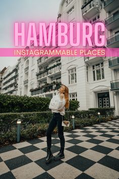 a woman standing in front of a building with the words hamburg instagramable places