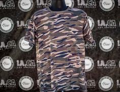 Step up your style with our Unisex Tiger Stripe Camo T-Shirt! This bold tee features a striking tiger stripe camo pattern, adding a unique twist to classic camouflage. Crafted from soft, high-quality polyester, it ensures all-day comfort and durability. The relaxed unisex cut fits both men and women, making it versatile for any wardrobe. Perfect for outdoor adventures, casual outings, or lounging at home, this t-shirt is a must-have. Features: Bold Tiger Stripe Camo Design Soft and Durable Polyester Relaxed Unisex Fit Versatile Style Easy Care Elevate your casual wear--order yours today! Tiger Stripe Camo, Streetwear Camouflage T-shirt With Letter Print, Camouflage Cotton T-shirt With Letter Print, Relaxed Fit Camouflage T-shirt With Graphic Print, Camouflage Graphic Print T-shirt For Streetwear, Camo Designs, Tiger Stripes, Outdoors Adventure, Camo