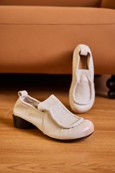 Chic Beige Almond Toe Slip-ons, Spring Workwear Slip-on Moccasins, Comfortable Beige Closed Toe Loafers, Beige Slip-on Leather Shoes For Spring, Cream Leather Shoes With Flat Heel For Spring, Casual Slip-on Flats With Brogue Detailing, Spring Beige Slip-on Loafers, Beige Slip-on Loafers For Spring, Comfortable Leather Flats With Low Heel