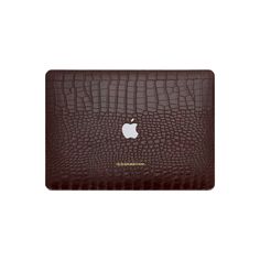 an apple macbook pro case in brown crocodile leather