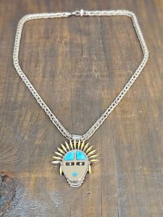 Handcrafted by Native American artist Smokey Chachu, this .925 sterling silver necklace boasts a striking turquoise Kachina pendant, accented with vibrant yellow opal. Add a touch of culture and bold color to any outfit with this unique statement piece. Unique Polished Turquoise Necklace, Yellow Opal, Native American Artists, Kids Earrings, Bold Color, Native American Jewelry, Barbie Girl, Sterling Silver Necklace, Stone Settings