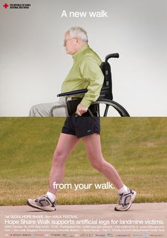 an old man in a wheel chair walking down the street with his legs spread out