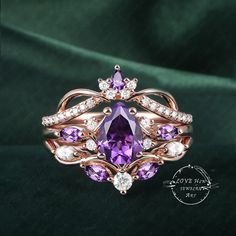 a ring with purple stones and white diamonds