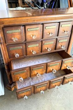 an old wooden dresser with many drawers