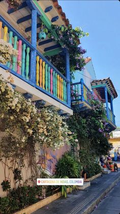 colorful balconies are painted on the side of this building in san juan de cristo