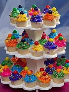 there are many cupcakes on the cake stand