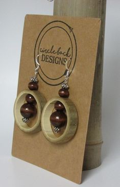 Bamboo earrings made from salvaged bamboo.  This pair includes wood and silver colored beads and silver hardware. The bamboo is sealed with Mod Podge and finished with clear, acrylic spray. Cheap Natural Wood Jewelry As A Gift, Wood And Bead Earrings, Coconut Jewelry, Bamboo Jewelry, Wooden Jewelery, Wood Jewelery, Bamboo Earrings, Bone Jewelry, Wire Crafts