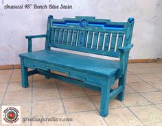 a blue bench sitting on top of a tiled floor