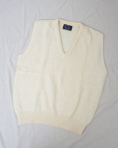 [the gentle hum of rain tapping on your windowpane]Vintage cream oversized wool sweater vest. Perfect for layering and staying cozy.•Sleeveless•V-neck•Oversized fit•Gorgeous woolLABEL: Jantzen - Made in USACONDITION: Vintage / ExcellentSIZE: Fits Oversized S/M or L more fittedErika is 5'10" and a size S in tops + M/L in bottoms. Please make sure to double check your measurements with the ones listed in the tab below. Beige Cotton Sweater Vest For Winter, Cream Cotton Sweater Vest For Winter, Cream Sweater Vest For Winter Layering, Classic Beige Wool Sweater Vest, Cream Cotton Sweater Vest For Fall, Cozy Wool Top In Cream, Cozy Wool Cream Top, Cozy Cream Wool Top, Classic White Sweater Vest For Winter