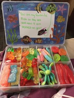 an open plastic box filled with different types of gummy bears and other candies