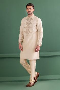 Cream kurta with metal applique embroidery in geometric pattern. Paired with matching aligadhi pant. - Aza Fashions Traditional Straight Kurta With Geometric Embroidery, Transitional Cotton Kurta With Geometric Embroidery, Designer Kurta With Geometric Embroidery For Festive Occasions, Festive Straight Kurta With Geometric Embroidery, Traditional Kurta With Geometric Embroidery For Eid, Navratri Long Sleeve Kurta With Geometric Embroidery, Festive Eid Kurta With Geometric Embroidery, Traditional Sets With Geometric Embroidery For Transitional Season, Traditional Fitted Kurta With Geometric Embroidery