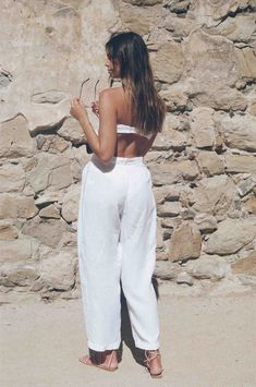 Vintage inspired white linen trousers, yes please! These natural dyed white linen trousers scream lets go on vacation and have ourselves a good time. They come with a linen tie that can be used as a matching tie top or hair tie. The tie is small, so we don't recommend expecting a full set out of it unless you are super tiny in the bust area. The white linen trouser has pleat detail in the front, belt loops and a dyed button for closure. The white linen trousers are pre shrunk for ultimate qualit White Linen Wide-leg Pants, White Linen Pants For Spring, White Linen Wide Leg Vacation Pants, White Linen Wide Leg Pants For Vacation, White Linen Straight Pants, White Linen Pants For Beach, White Linen Pants For The Beach, Chic White Linen Wide Leg Pants, White Linen High-waisted Pants