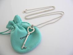 Overview:Offered for sale is a fantastic and very pretty Tiffany and Co. Sterling Silver Large Heart  Key Necklace on a 34 inch Beaded Chain.   Wonderful necklace that fits a lifestyle on the go -- the necklace can be worn to almost any occasion! Hanging from its beautiful Tiffany & Co. sterling silver beaded chain is a gorgeous Large Heart Key pendant - awesome statement piece!   It is simple and yet looks extremely elegant.  Perfect way to say "Here's the key to my heart :)" without ever Tiffany Key Necklace, Tiffany Key, The Key To My Heart, Tiffany And Co Necklace, Necklace Outfit, Heart Key, Large Heart, Tiffany Jewelry, Heart And Key