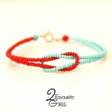 two bracelets with red and blue beads