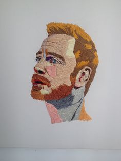 a drawing of a man's face made out of legos