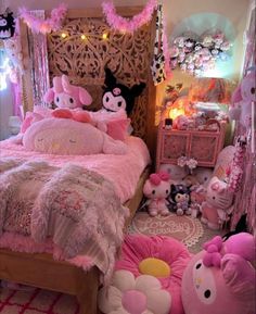 a bedroom decorated in pink and white with hello kitty decorations