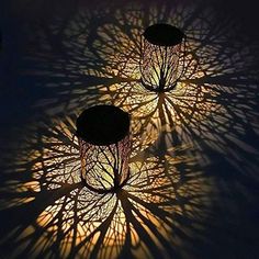 three lights that are on top of each other in the shape of tree branches with their tops turned upside down