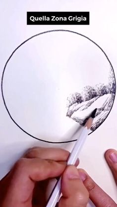 someone is drawing a circle with a pencil