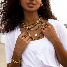 Elevate your everyday look with our Thick Figaro Necklace in Gold. This long statement chain necklace is the perfect for layering in your necklace stack or wearing alone. Thick Figaro Statement Chain Necklace Length: 22.5" Material: Stainless Steel Plating: 18k Real Gold Necklace is 100% nickel-free and cadmium-free Necklace is hypoallergenic and tarnish resistant Lobster claw clasp closure Everyday Multi-strand Yellow Gold Chain Necklace, Yellow Gold Layered Figaro Chain Necklace, Everyday Multi-strand Figaro Chain Necklace, Tarnish Resistant Link Chain Necklace For Layering, Tarnish-resistant Link Chain Necklace For Layering, Real Gold Necklace, Necklace Stack, Figaro Necklace, Jewel Necklace