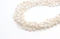 Tiny Buttons™ necklace is the ideal necklace to pair with a white shirt or blouse. Five strands of rich white freshwater button pearls and Swarovski© crystal create a versatile piece you can wear with anything. White Crystal Pearl Bracelet For Formal Occasions, Formal White Crystal Pearl Bracelet, White Multi-strand Pearl Necklace For Formal Occasions, White Crystal Jewelry With Pearl Charm, Elegant White Crystal Pearl Bracelet, White Beaded Pearl Necklace For Formal Occasions, White Pearl Embellished Beaded Necklace For Formal Occasions, Classic White Crystal Necklace, White Multi-strand Pearl Embellished Necklace