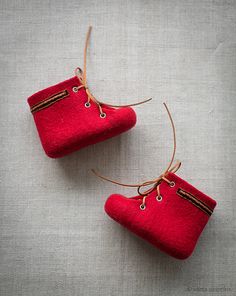 two small red purses tied together with twine