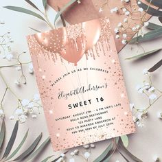 a pink and gold sweet 16 birthday party card with balloons on it, surrounded by baby's breath flowers