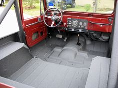 the interior of an old red truck