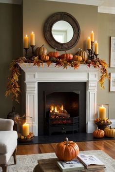 a living room filled with furniture and a fire place covered in pumpkins next to a mirror