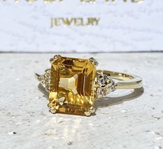 Don't miss this opportunity to own this beautiful gemstone ring crafted in 14k gold filled => Gemstone Type - Citrine, Clear Quartz => Gemstone Cut - Faceted => Gemstone Size - 8*10 mm, 2 mm => Total Number of Gemstones - 7 => Metal Type - 14k Gold Filled (Tarnish Resistant And Nickel Free) - also available in 925 sterling silver * Please contact me for pricing on a sizes larger than 11 * ~ Feel free to ask me about custom made designs. ❏ Replacements and custom orders : ✪ 925 ste Engagement Ring Rectangle, Opal Necklace Simple, Ring Rectangle, Yellow Citrine Ring, Rough Stone Ring, Statement Engagement Ring, November Birthstone Jewelry, Rectangle Ring, Citrine Jewelry