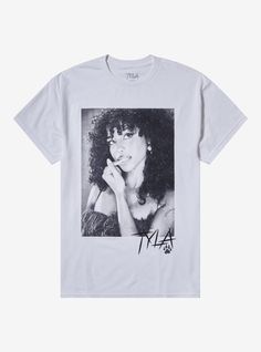 a white t - shirt with an image of a woman's face on it