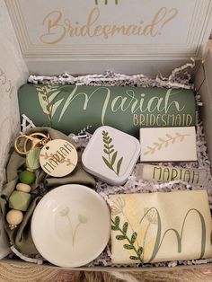 the bridesmaid box is filled with personalized items for her special day,