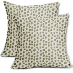 two pillows with green spots on them