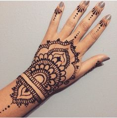 a henna tattoo on the palm of someone's hand