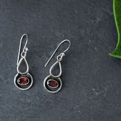 "Handmade sterling silver drop earrings. Comes in garnet and moonstone 1\" x 0.5\"" Nickel-free Garnet Drop Earrings, Teardrop Garnet Silver Jewelry, Silver Garnet Drop Earrings, Silver Garnet Dangle Earrings, Art Jewelry Earrings, Handmade Silver Jewellery, Lotus Earrings, Silver Jewelry Design, Sterling Silver Drop Earrings