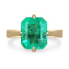 Displayed is a classic Colombian emerald solitaire emerald-cut engagement or right-hand ring in 14K yellow gold. This gorgeous solitaire ring carries a full 3.81-carat emerald in an offset four-prong setting. Fully faceted, this gemstone showcases excellent shine. The emerald has very good clarity with minor flaws that are normal in all genuine emeralds, but no carbon spots (black) or harsh flaws are found in this beauty! The gem has a stunning green color and very good luster. An ideal solitair Genuine Emerald Ring, Solitaire Gold Engagement Ring, Emerald Gold Ring, Emerald Necklace Pendant, Columbian Emeralds, Gold Solitaire Engagement Ring, Emerald Cut Engagement, Right Hand Rings, Hand Ring