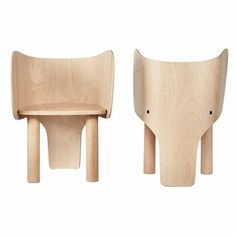 two wooden chairs sitting next to each other