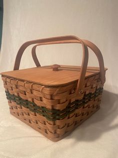 a wooden basket sitting on top of a white table