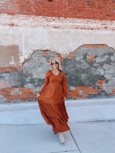 Make a statement in our Be The One Maxi Dress! This stunning dress features a smocked ruffle tiered design and a flattering v-neck. With long sleeves and available in a variety of colors, including cherry merlot, emerald, and camel, you'll be sure to turn heads wherever you go. Show off your style and confidence with this must-have dress! Patriotic Tees, Athleisure Tops, Be The One, Top Graphic Tees, Glitz And Glam, Halloween Tees, Tee Dress, Merlot, Gift Accessories