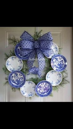 a wreath with blue and white plates on it