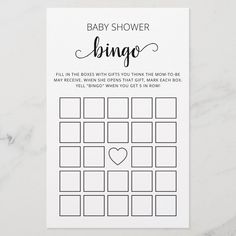 the baby shower game is shown on a marble surface with black and white text that reads,