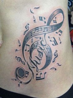 a woman's stomach with music notes and musical symbols on it