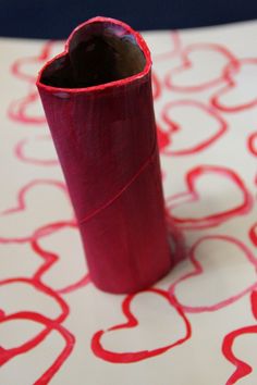 a roll of red paper with the words 10 heart stamp adventures written on it in white and red