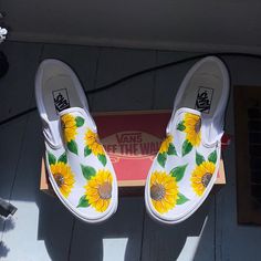 Hand Painted Custom Sunflower White Slip On Vans High Quality And Professional Grade Materials Used All Shoes Are Made To Order And Are Unique (See The Last Photo For This Specific Pair) Message Me For Any Size! *Shoes Can Never Be Directly Identical To These Photos As They Are Hand Painted Every Time* Make Me An Offer!! Vans Floral Print Sneakers For Summer, Vans Floral Print Summer Sneakers, White Vans Sneakers For Summer, Painted Vans Slip On, Vans Ideas, Hand Painted Vans, Shoe Drawing, Sunflower Vans, White Slip On Vans